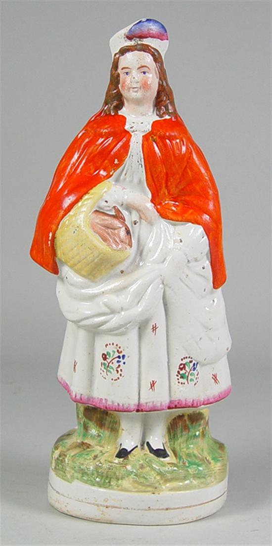 Appraisal: Staffordshire Figure of Woman with Rabbits Mid th Century Bright