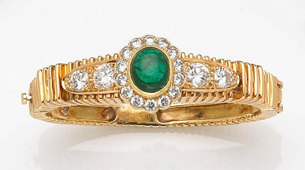 Appraisal: An emerald diamond and eighteen karat gold bracelet the hinged