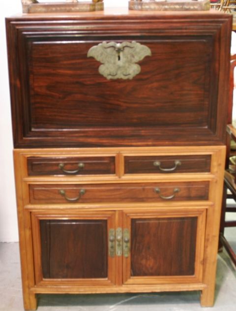 Appraisal: A Chinese chest on cabinet elm and blackwood top with