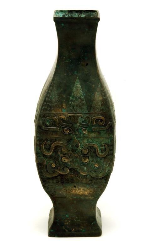 Appraisal: A Chinese archaic bronze vase Squared baluster form decorated with