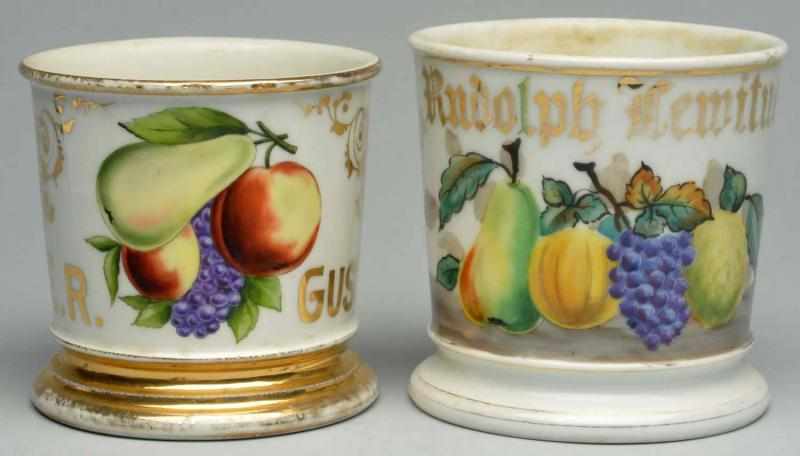 Appraisal: Lot of Fruit Related Shaving Mugs Highly decorative Both mugs