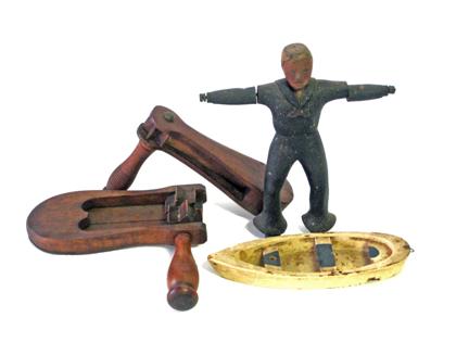 Appraisal: Carved and painted whirligig sailor boat and two noisemakers th