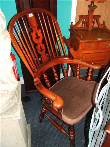 Appraisal: A th Century ash and elm Windsor open armchair with