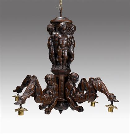 Appraisal: Continental carved walnut four-light chandelier late th early th century