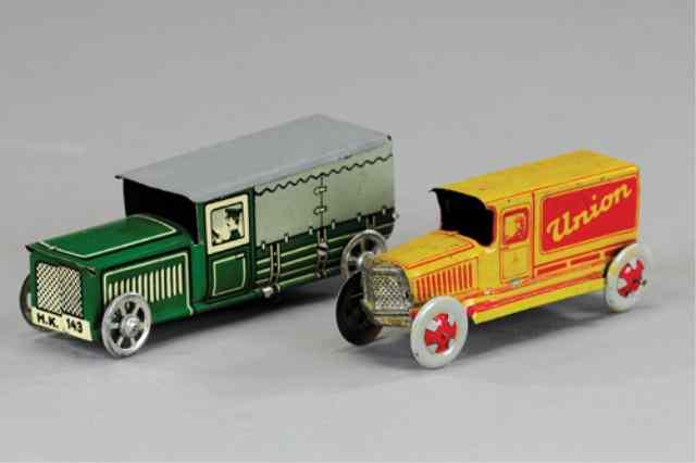 Appraisal: LOT OF TWO PENNY TOY TRUCKS Both lithographed tin driver