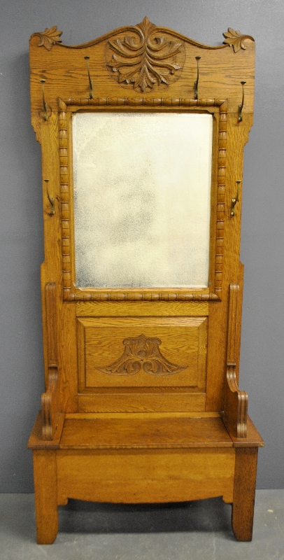 Appraisal: - Oak bench hall mirror c with carved crest h