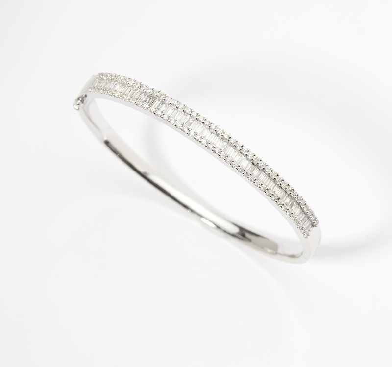 Appraisal: K white gold set with round full-cut and tapered baguettes