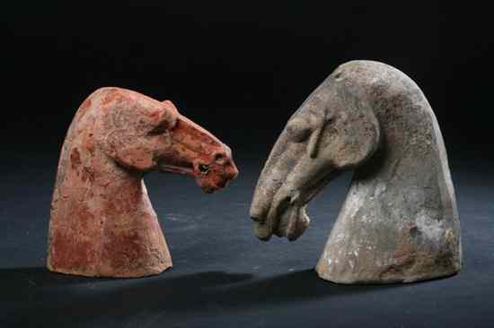 Appraisal: TWO CHINESE POTTERY HEAD OF HORSES Han Dynasty circa AD