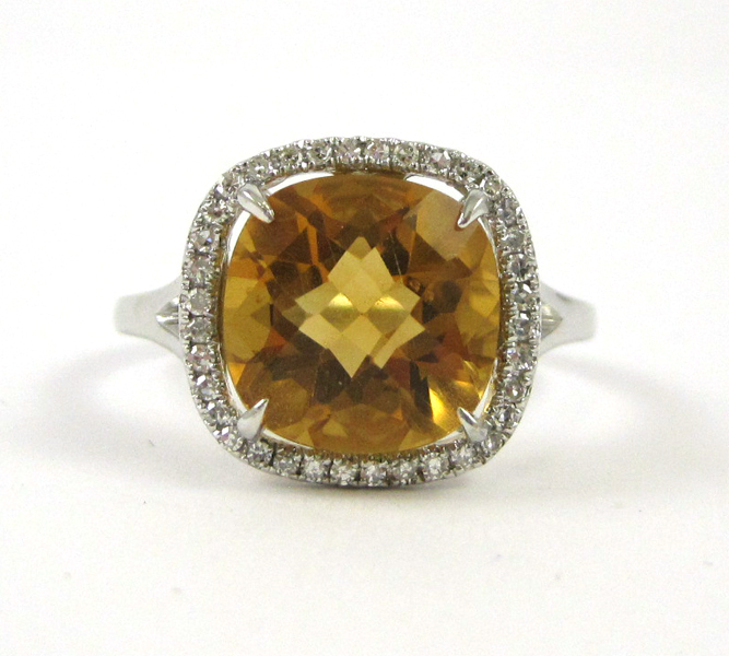 Appraisal: FOURTEEN KARAT WHITE GOLD CITRINE AND DIAMOND RING checkerboard-cut citrine