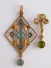 Appraisal: A ruby pearl and peridot pendant in yellow metal tests