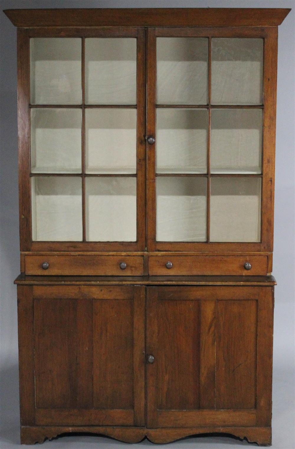 Appraisal: COUNTRY SHERATON STAINED STEP-BACK CUPBOARD in two pieces the upper