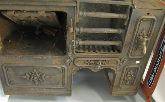 Appraisal: th Century cast iron stove embossed with flowers h w