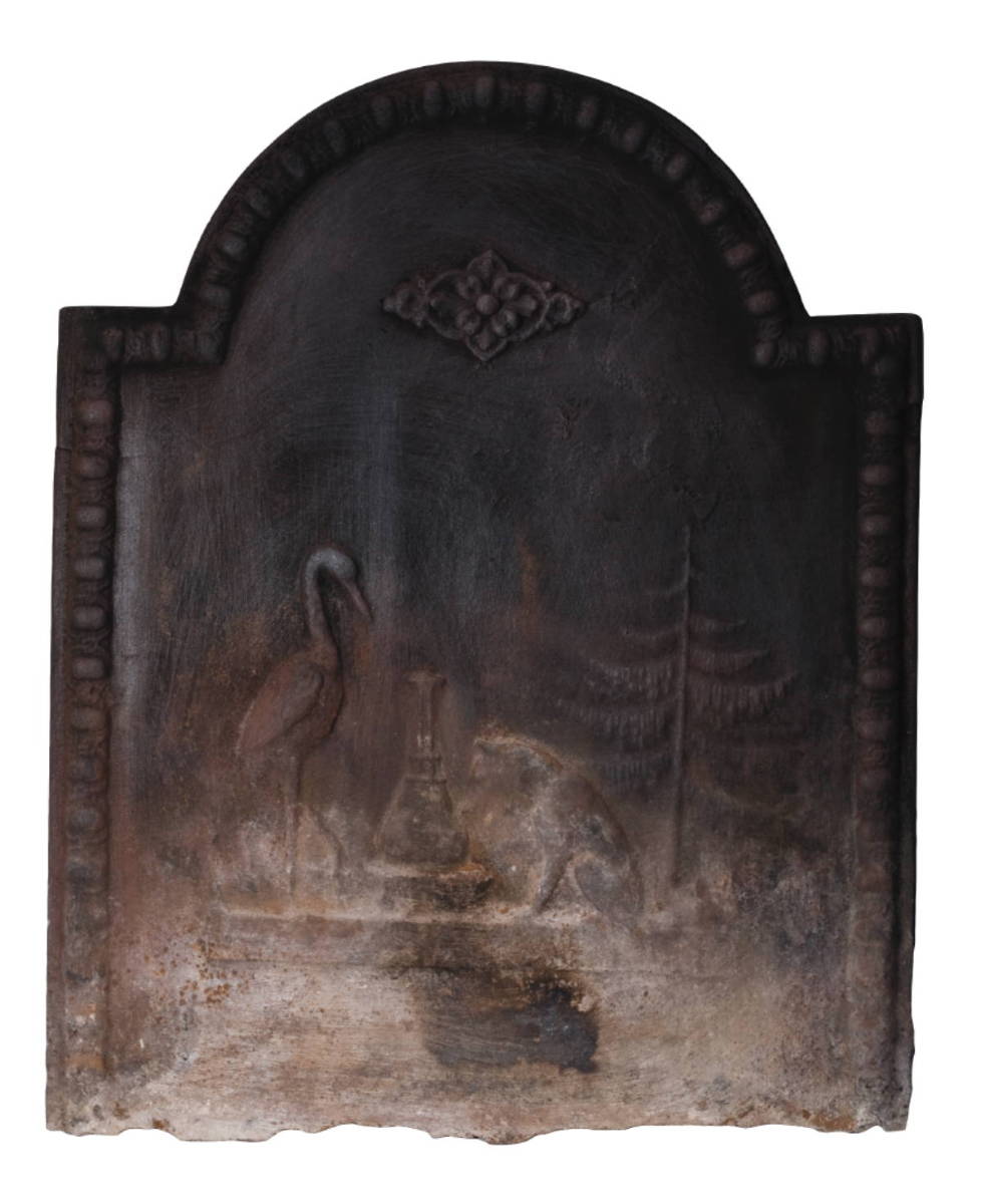 Appraisal: CAST IRON TOMBSTONE FIREBACK WITH FANCIFUL DECORATION The fireback depicting