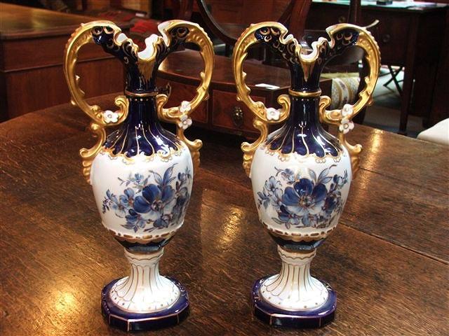 Appraisal: A PAIR OF ROYAL DUX DOUBLE-HANDLED VASES decorated blue flowers