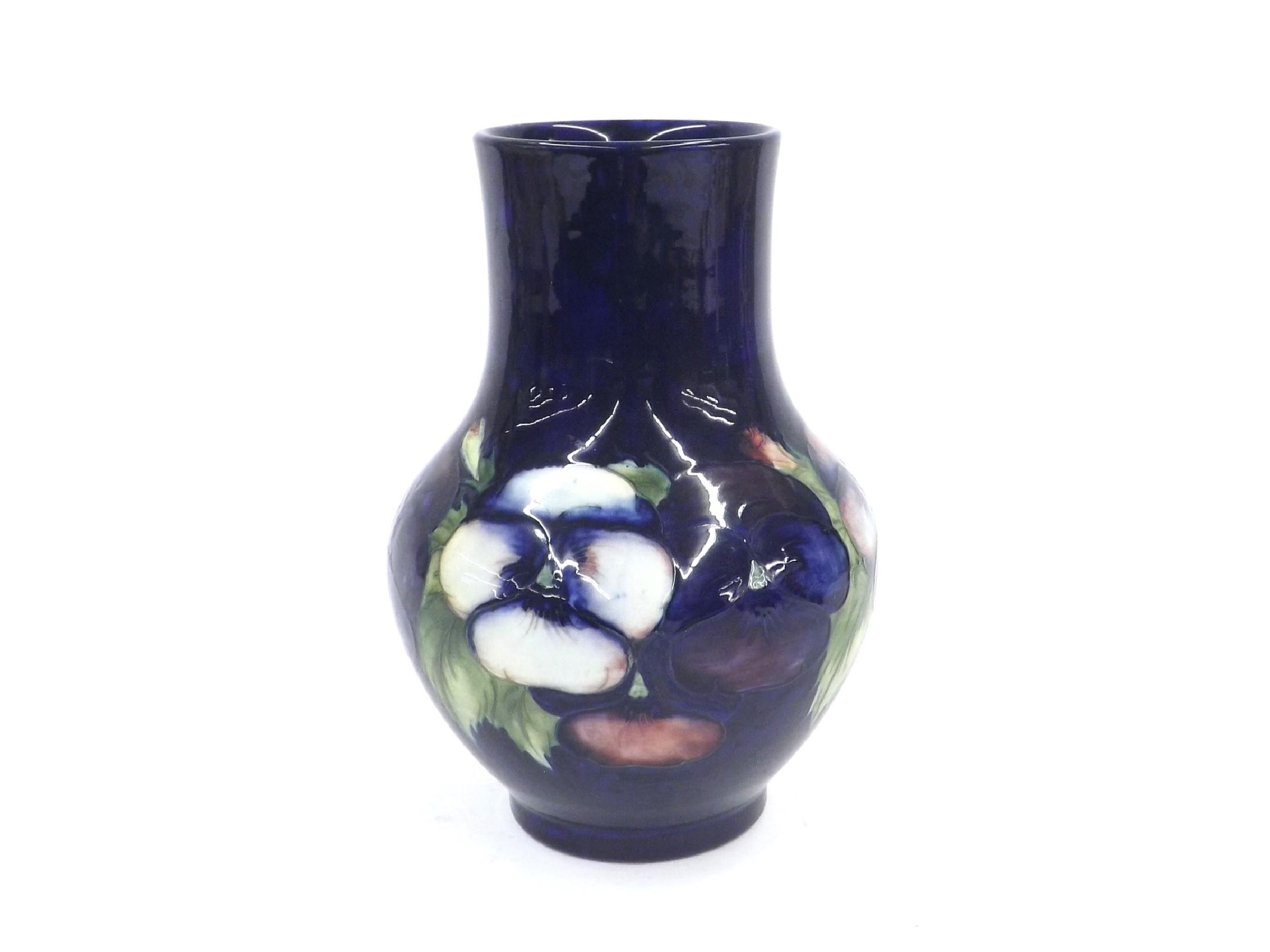 Appraisal: Moorcroft 'Pansy' pattern baluster vase decorated upon a rich blue