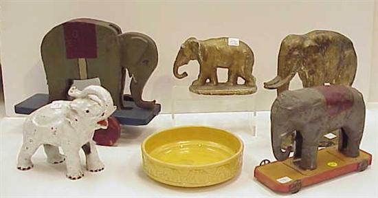 Appraisal: Elephant collectibles two elephant pull toys one metal one wood