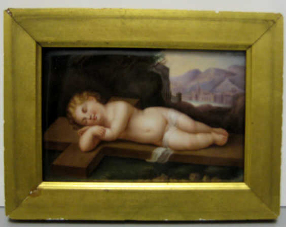 Appraisal: GERMAN PAINTED PORCELAIN PLAQUE Depicting Christ baby sleeping on a