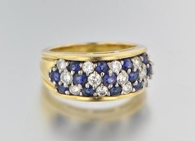 Appraisal: A Diamond and Sapphire Cluster Ring k yellow gold ring