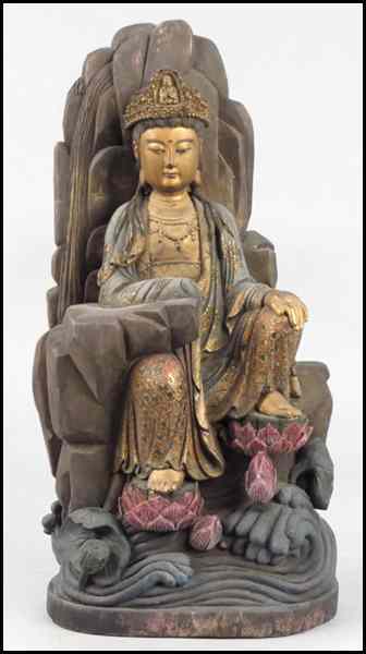 Appraisal: PARCEL GILT AND PAINTED WOOD SEATED FIGURE Depicted on a