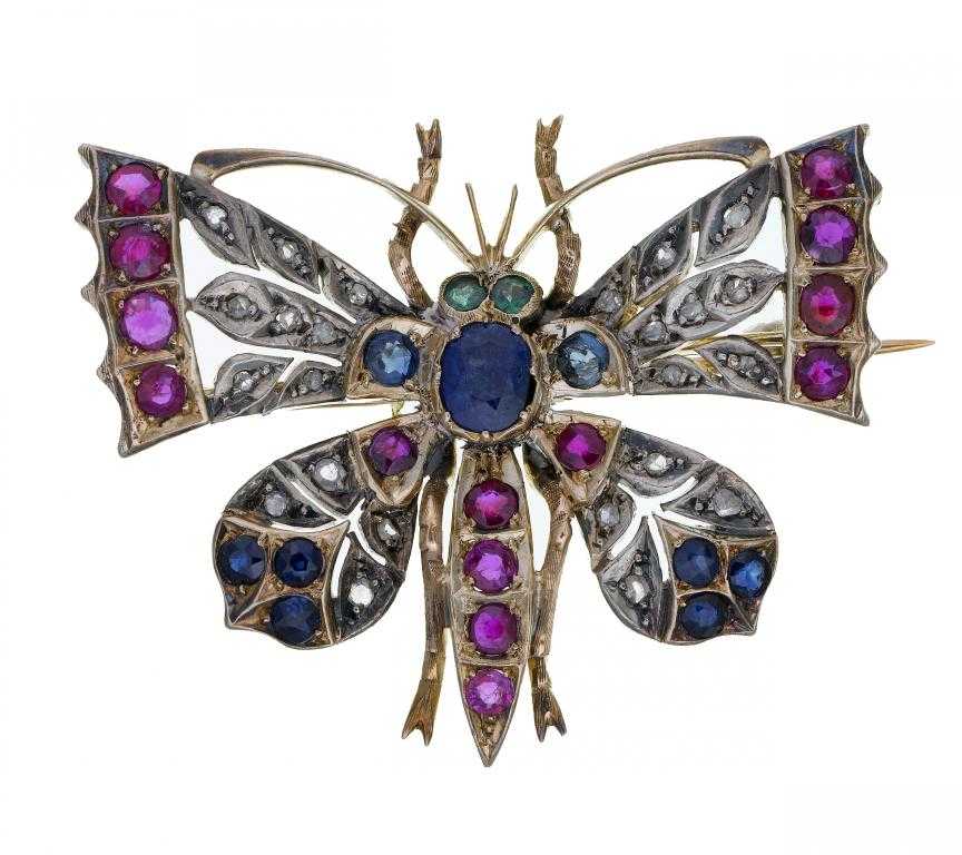 Appraisal: A DIAMOND EMERALD RUBY AND SAPPHIRE BUTTERFLY BROOCH in gold