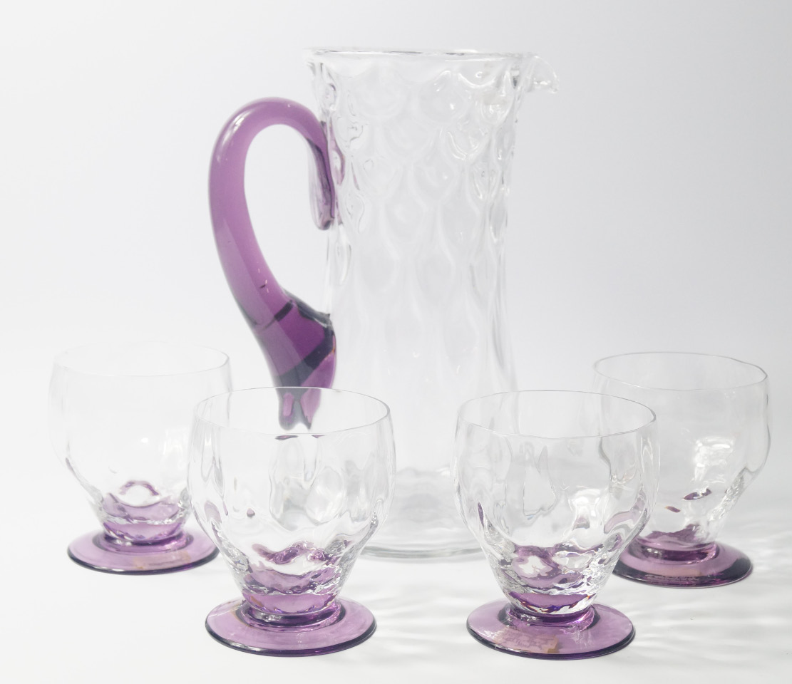 Appraisal: A Whitefriars clear and amethyst glass lemonade set comprising jug