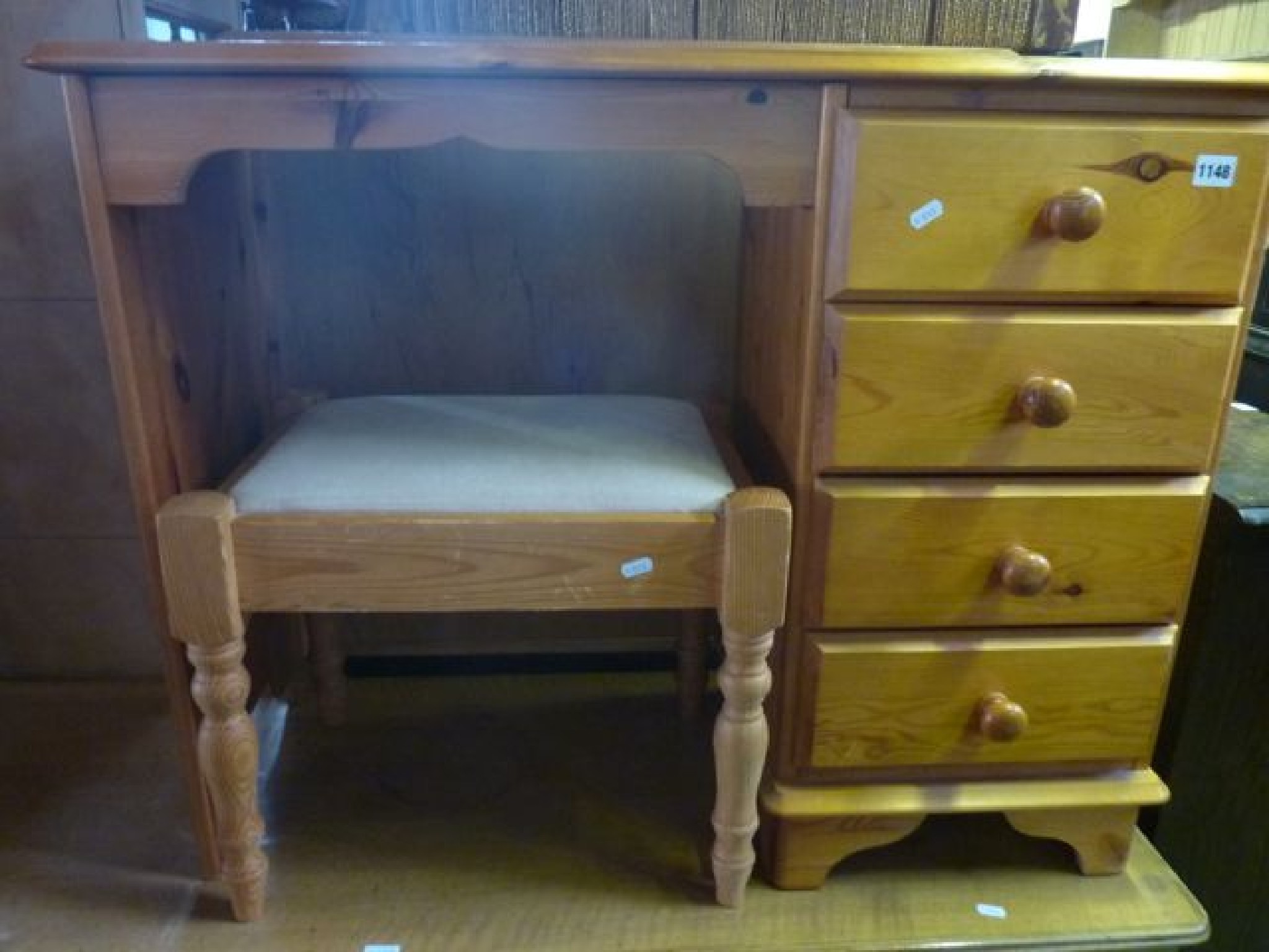 Appraisal: A contemporary stripped pine kneehole single pedestal dressing table fitted