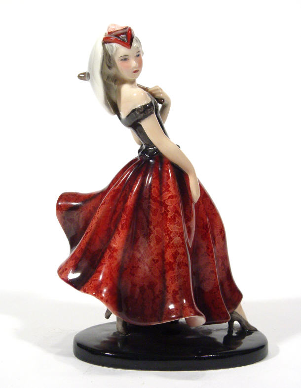 Appraisal: Goldscheider Art Deco pottery figurine clutching a parasol in a