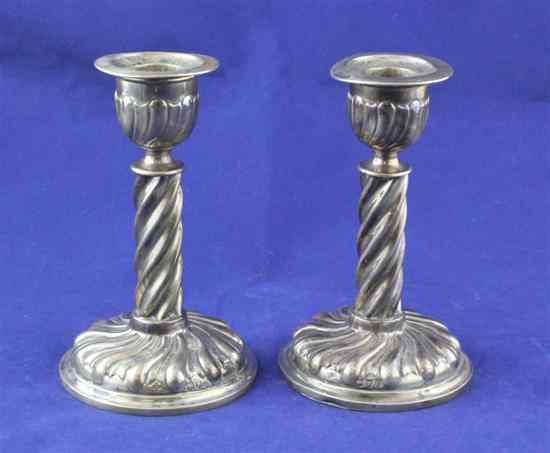 Appraisal: A pair of late Victorian silver dwarf candlesticks with spiral