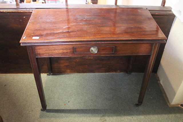 Appraisal: A GEORGE III MAHOGANY RECTANGULAR FOLD OVER TEA TABLE the