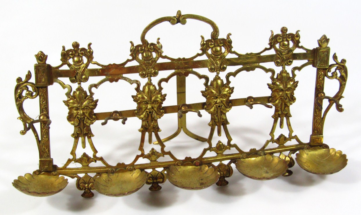 Appraisal: An early thC brass stand with an elaborate back set