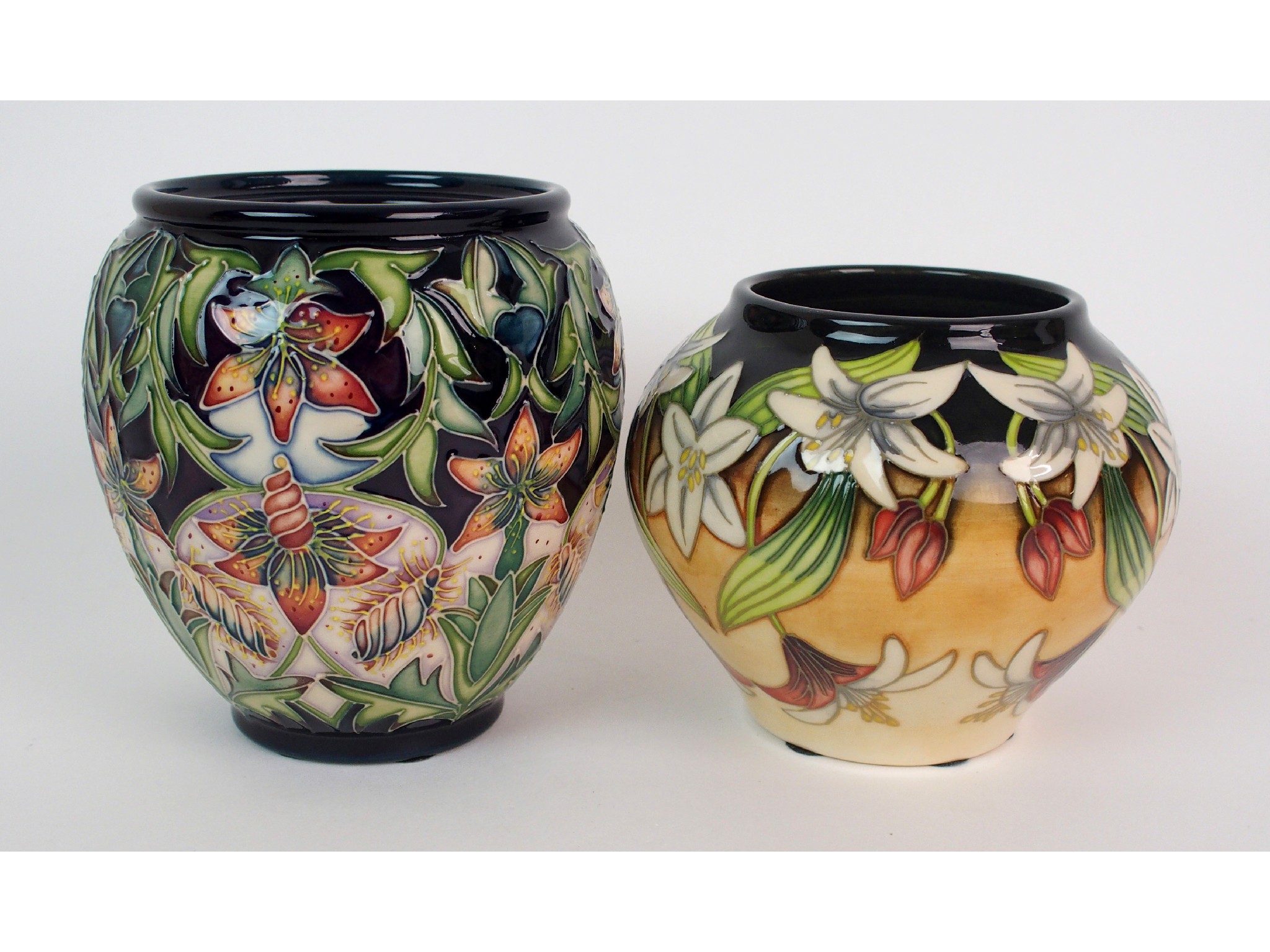 Appraisal: Two Moorcroft Pottery vasesboth of ovoid-form one in the Scintilla