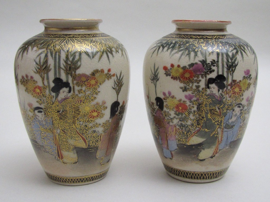 Appraisal: A small pair of Satsuma vases painted with ladies and