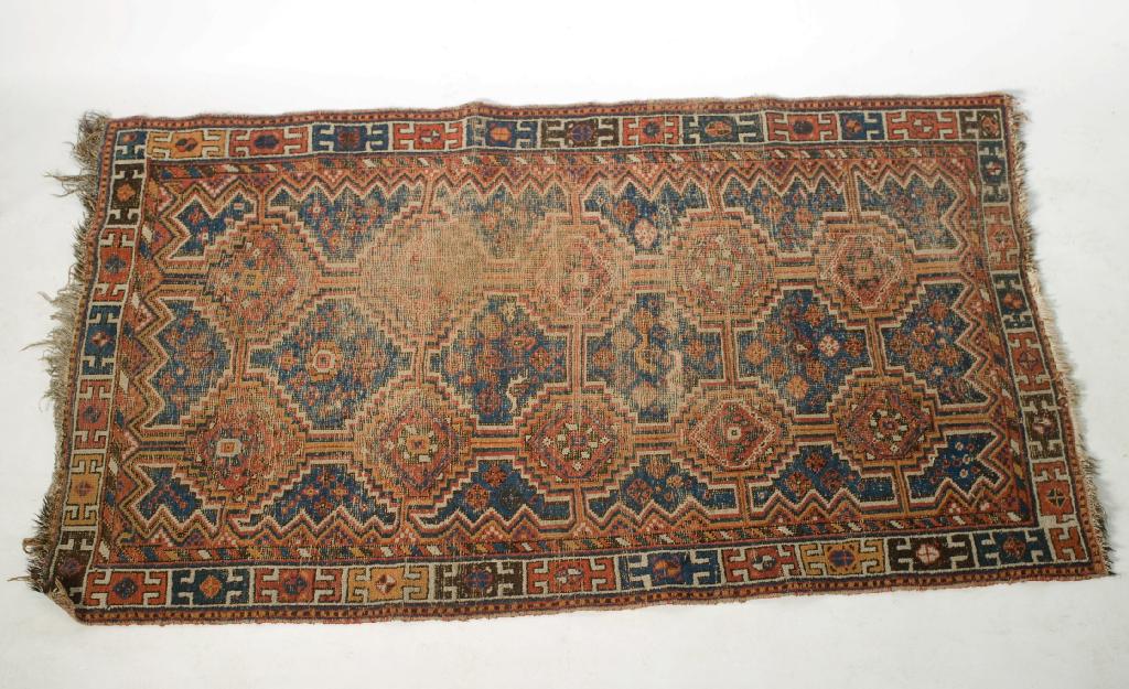 Appraisal: ANTIQUE CAUCASIAN RUG c the centre with a blue ground