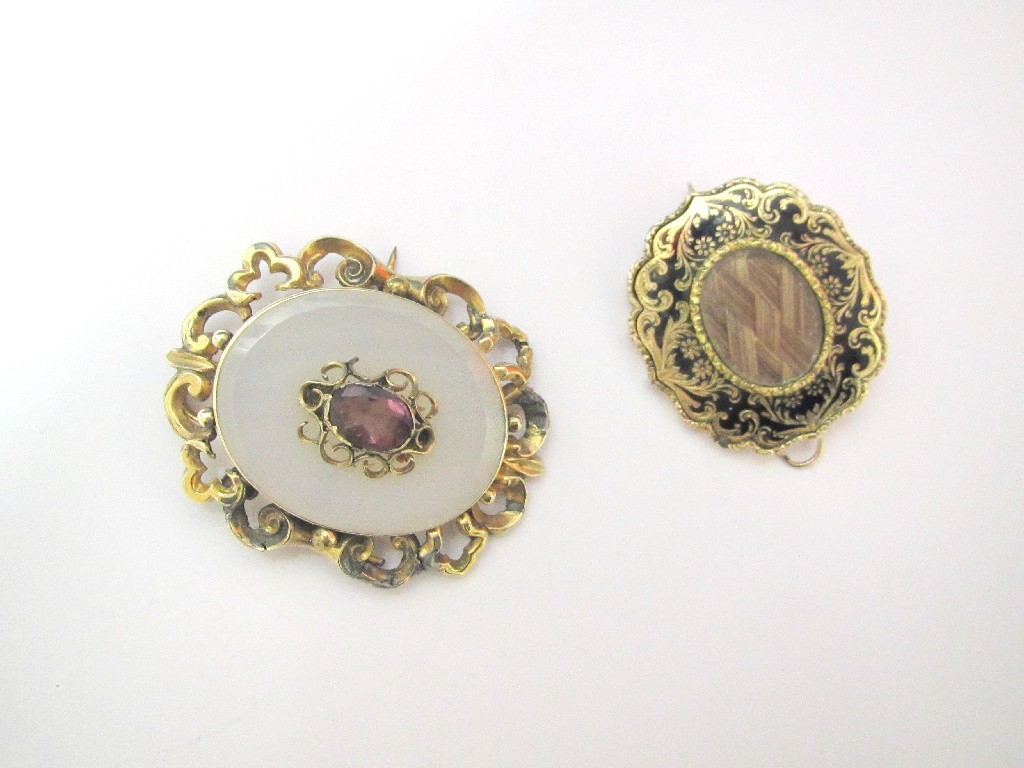 Appraisal: Victorian gold mourning brooch with black enamel and engraved floral