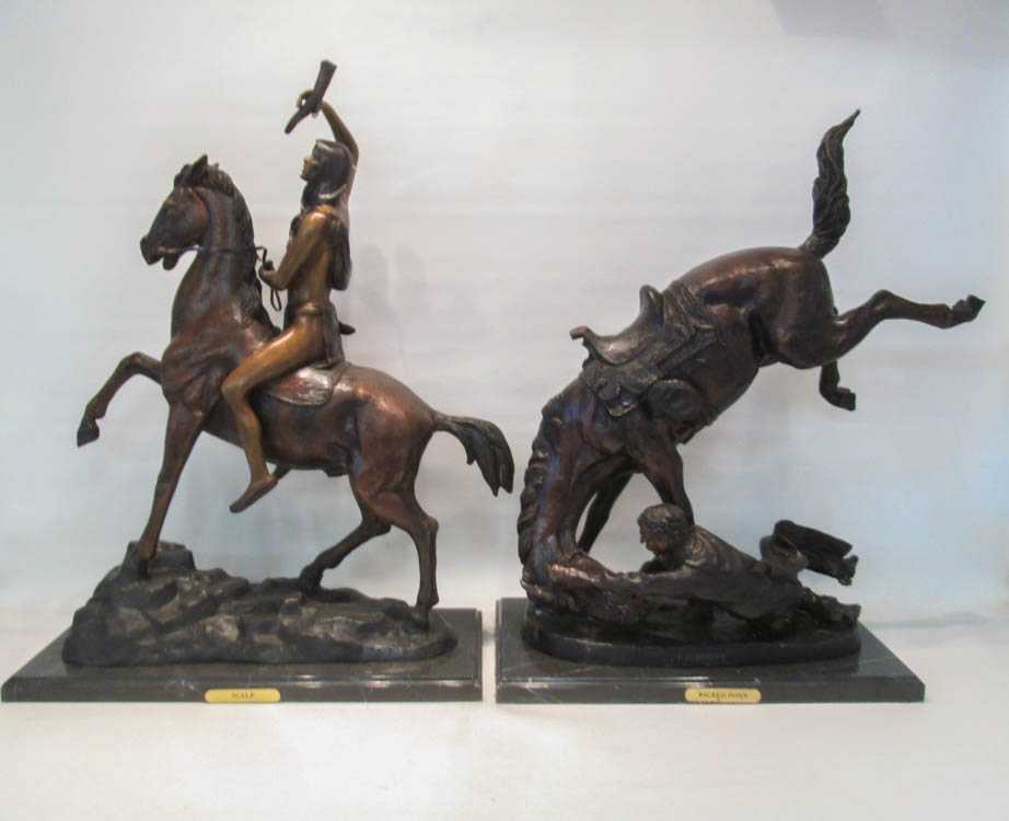 Appraisal: TWO PATINATED BRONZE SCULPTURES AFTER FREDERIC REMINGTON depicting figures on