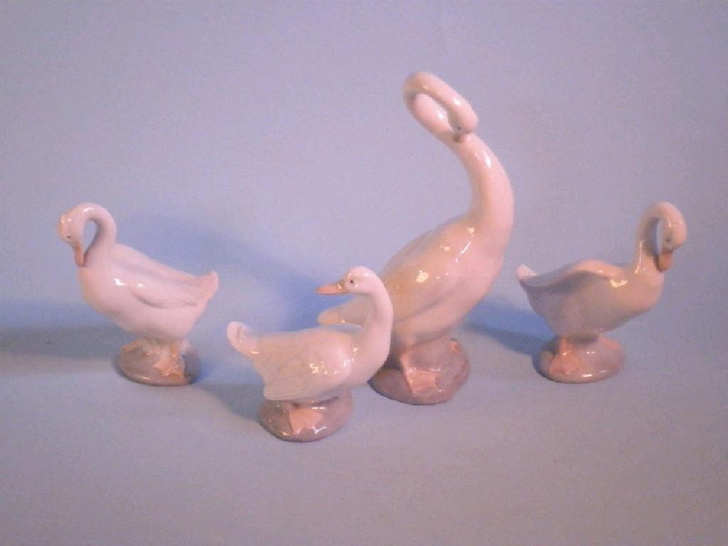 Appraisal: Two Nao swans a goose and another similar