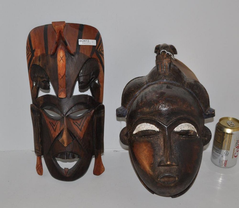 Appraisal: Two Carved Wood African Masks Largest high wide Age cracks