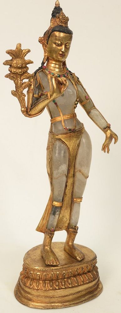 Appraisal: Asian Rock Crystal and Gilt Bronze Deity bronze figure mounted