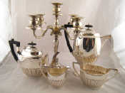 Appraisal: A silver plated four piece half ribbed oval teaset by