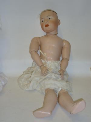 Appraisal: A composition dolls body with jointed limbs now set with