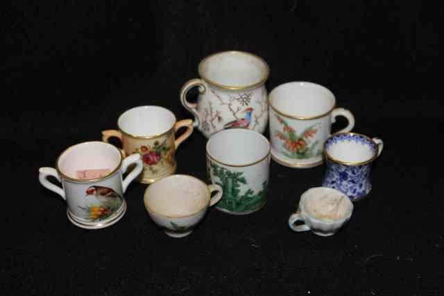 Appraisal: A SMALL COLLECTION OF MINIATURE MUGS including a th Century