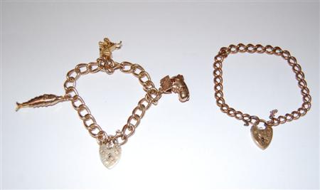 Appraisal: A ct gold oval link charm bracelet with heart shaped