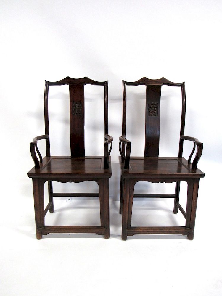 Appraisal: Pair of Chinese Rosewood Yoke Back Arm Chairs Angular crest