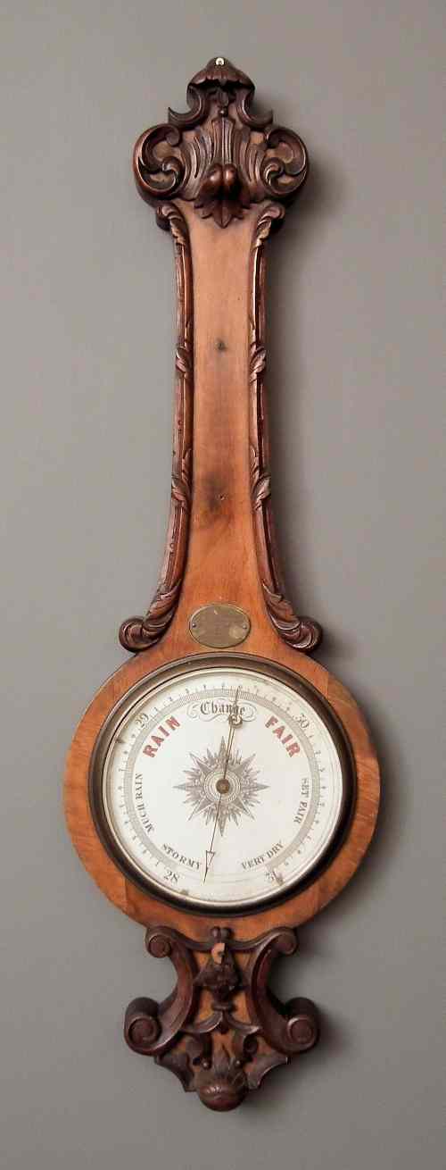 Appraisal: A late Victorian walnut cased wheel barometer with ins diameter