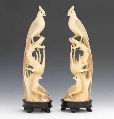 Appraisal: A Pair of Carved Ivory Bird Figurals Beautifully carved seated