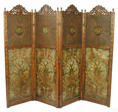 Appraisal: A carved oak four fold screen with floral painted leather