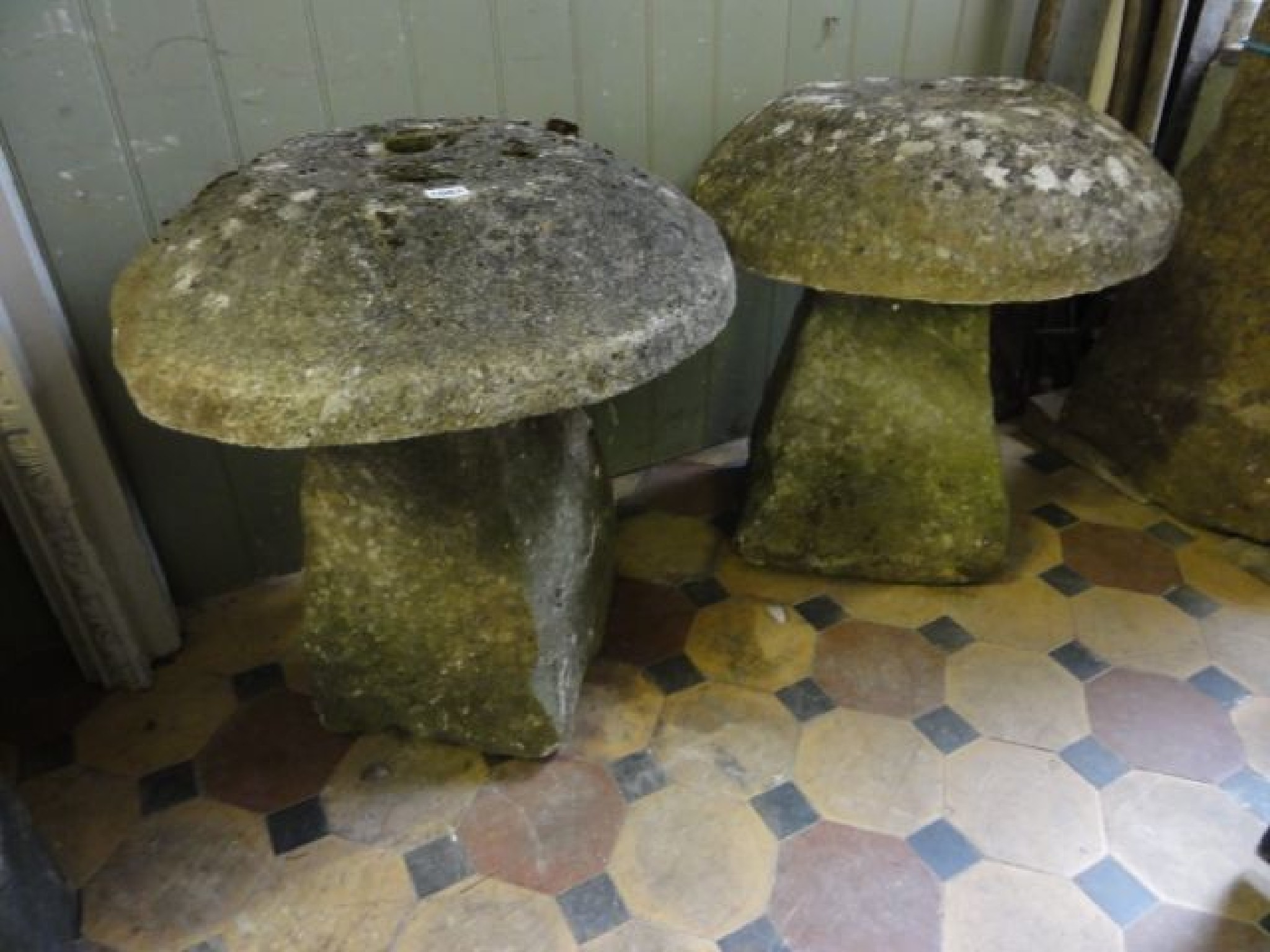 Appraisal: A near pair of staddle stones with weathered natural stone