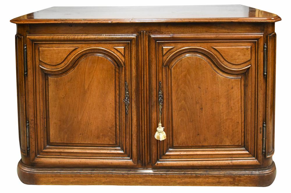 Appraisal: FRENCH PROVINCIAL WALNUT BUFFET th Century the molded top over