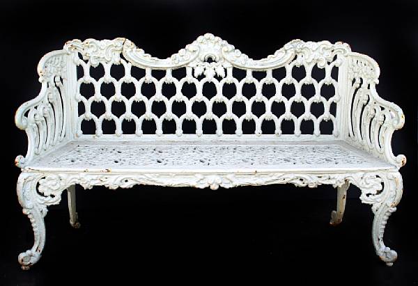 Appraisal: A paint decorated cast iron garden bench with pierced decoration