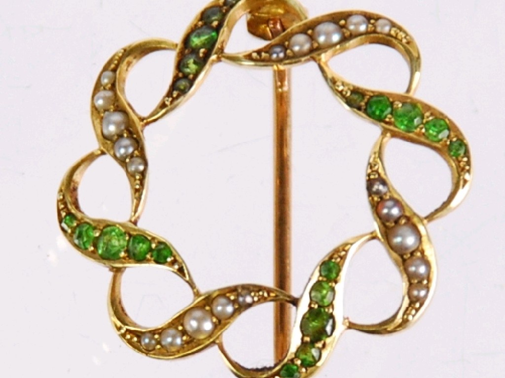 Appraisal: EDWARDIAN ct GOLD INTERLACED CIRCLET BROOCH set with olivines and